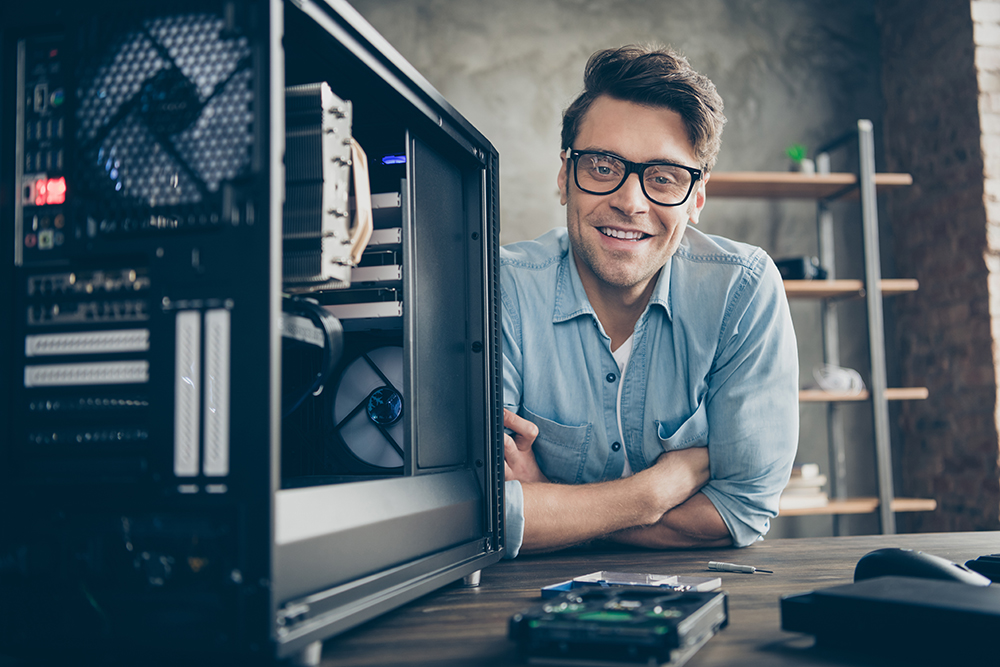 Close-up portrait of his he nice attractive, cheerful practitioner guy expert specialist technician repairing hardware home-based company at modern loft industrial home office work place station