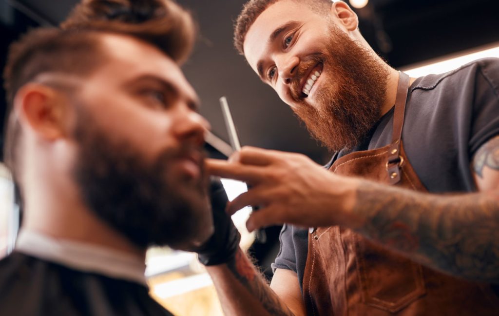Sole Trader Management Liability (picture of a barber working)