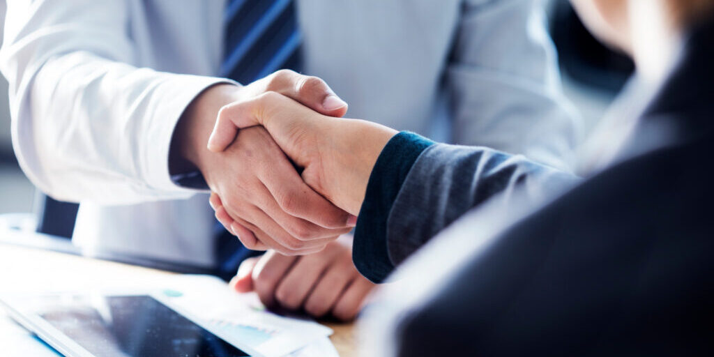 Business handshake in the office